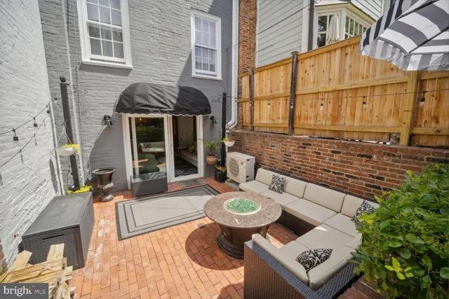 a view of a chairs and table in backyard