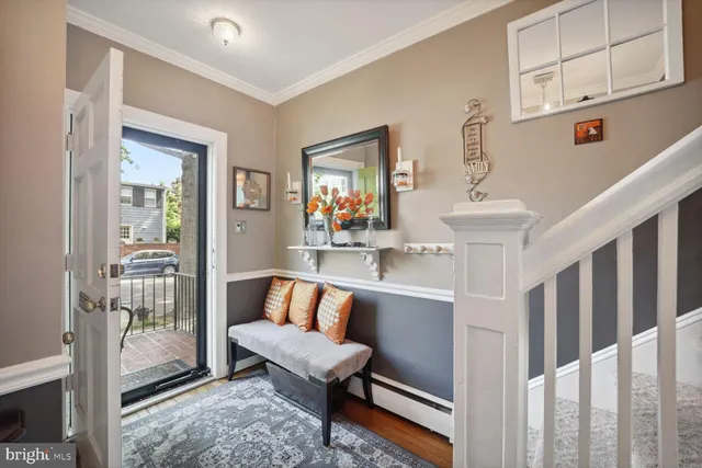 a living room with furniture and a rug