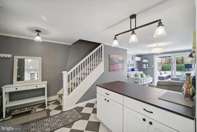 a view of hall way with furniture and staircase