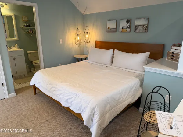 a bedroom with bed and a window