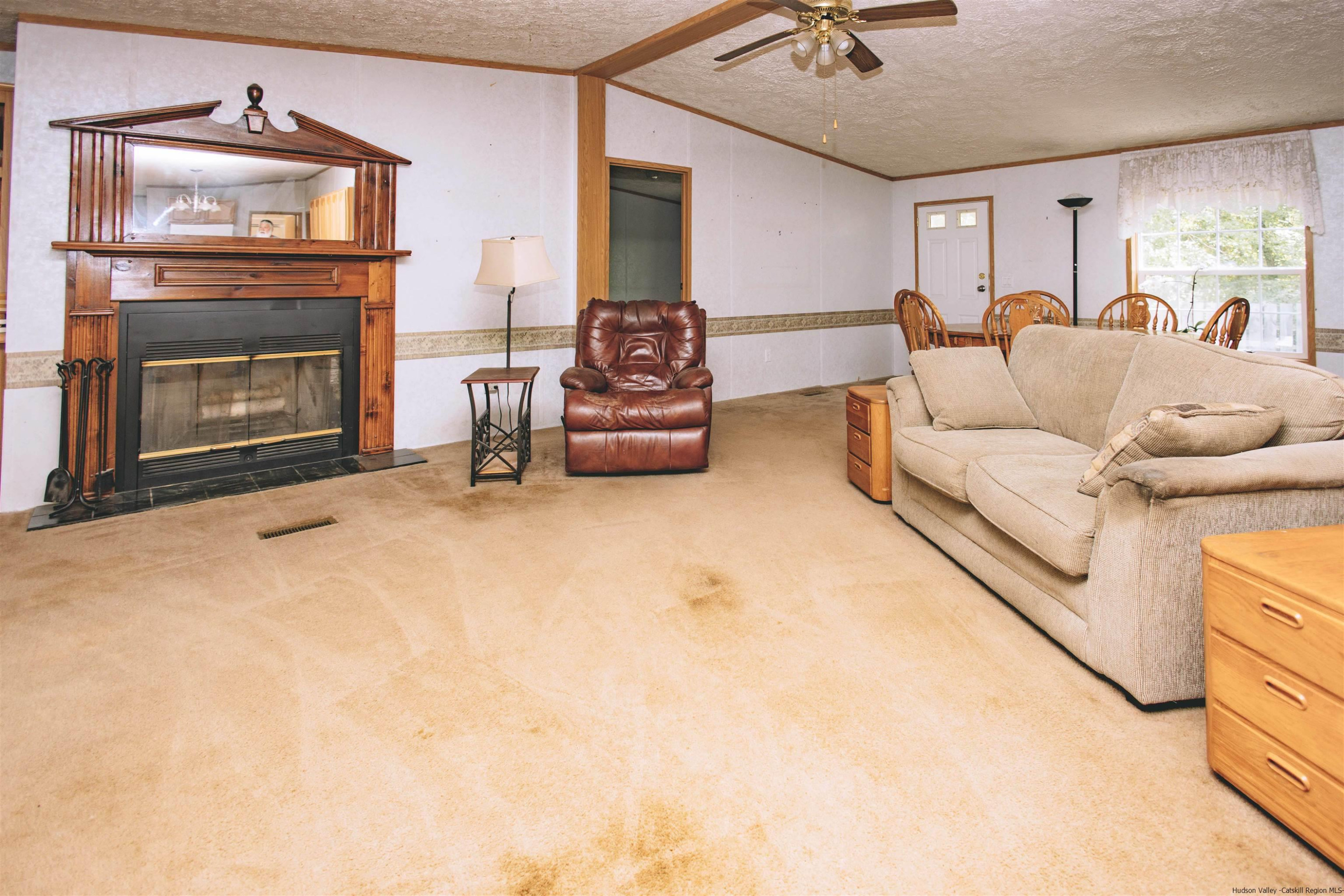 186 Patch Road Saugerties, NY 12477 - Photo 11 of 34 a living room with furniture and a fireplace