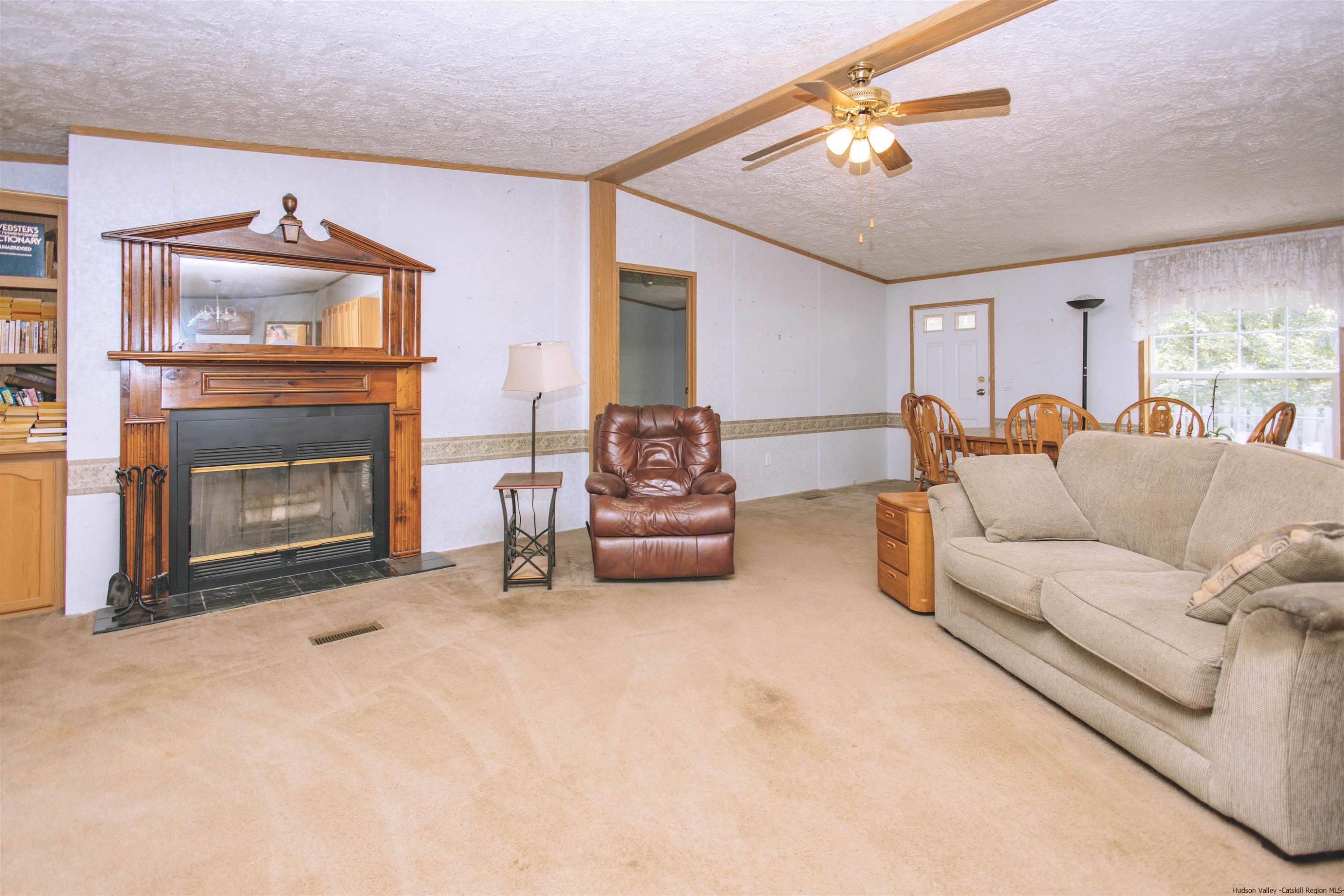 186 Patch Road Saugerties, NY 12477 - Photo 12 of 34 a living room with furniture and a fireplace