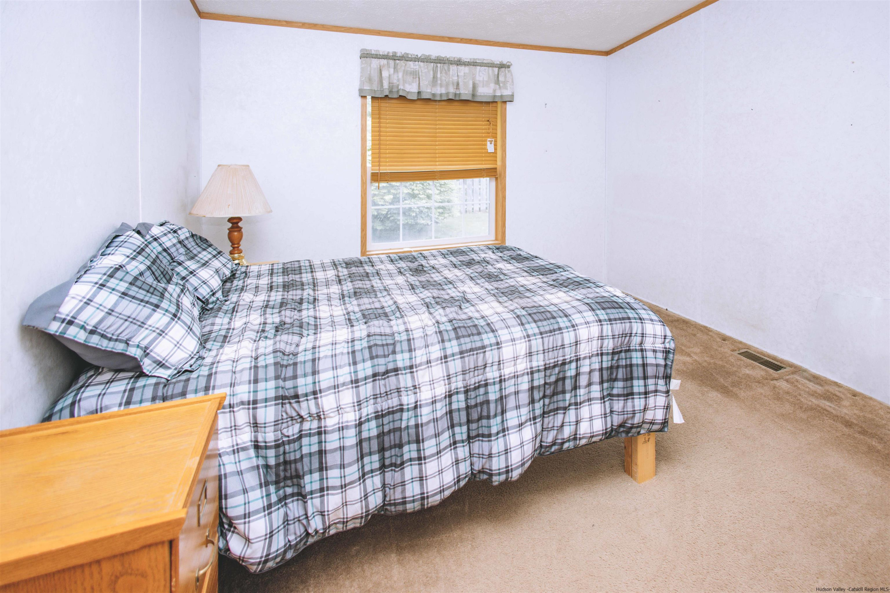 186 Patch Road Saugerties, NY 12477 - Photo 16 of 34 a bedroom with a bed and a window