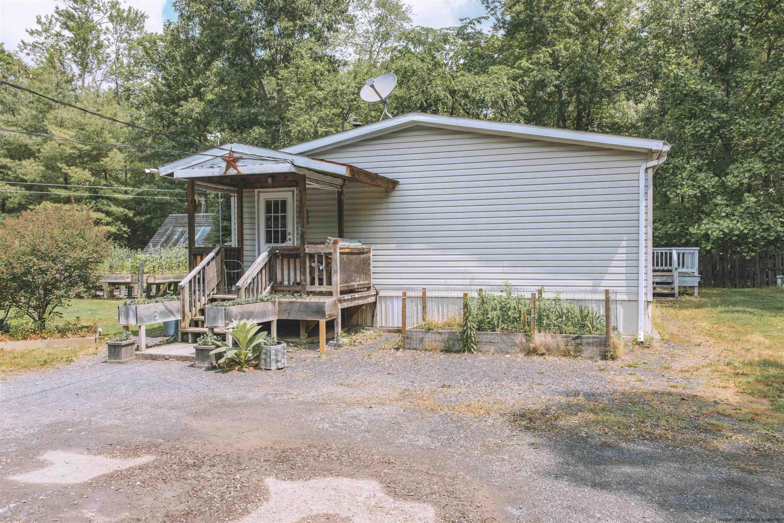 186 Patch Road Saugerties, NY 12477 - Photo 2 of 34 a front view of a house with a yard