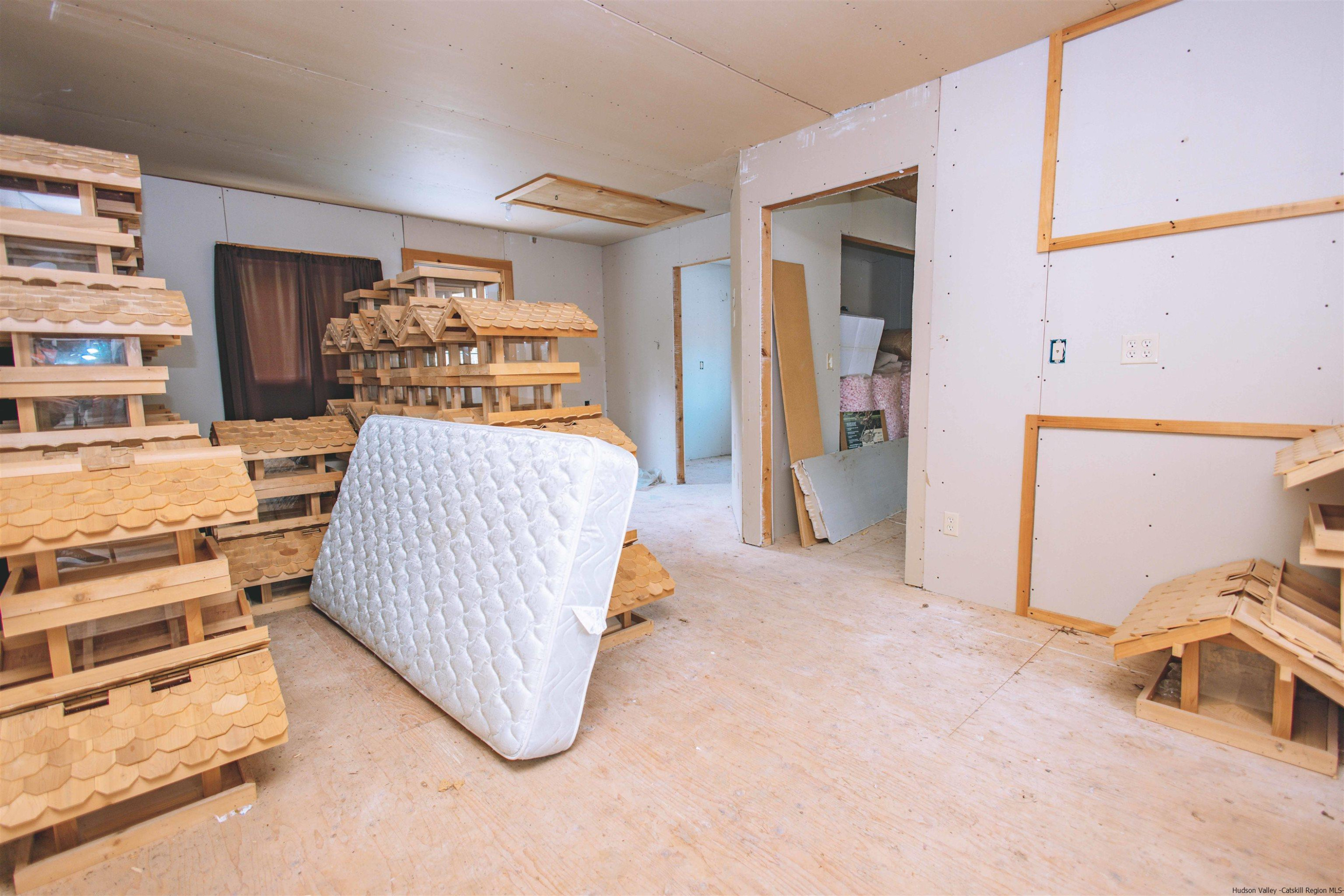 186 Patch Road Saugerties, NY 12477 - Photo 21 of 34 a bedroom with furniture and a wooden floor