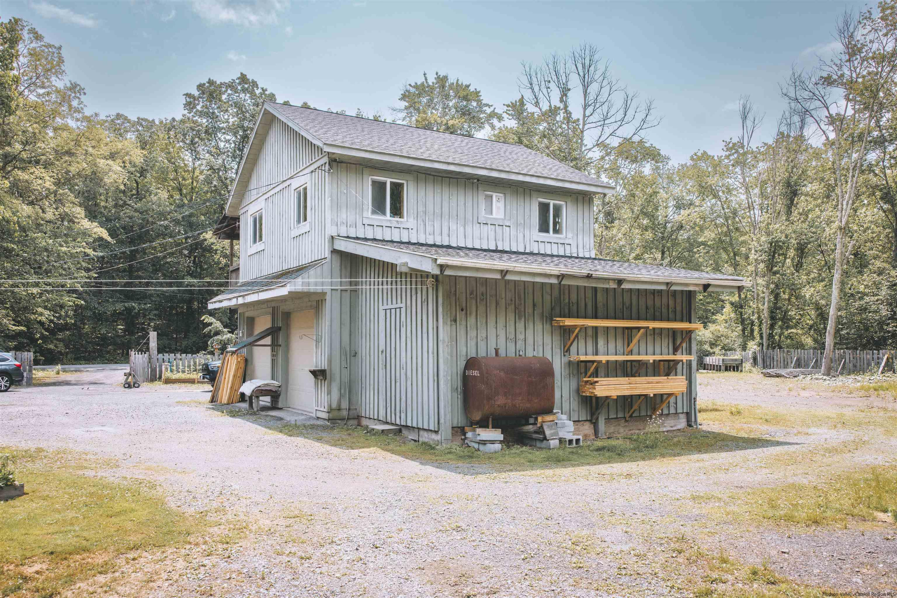 186 Patch Road Saugerties, NY 12477 - Photo 30 of 34 a view of a house with a yard and garage