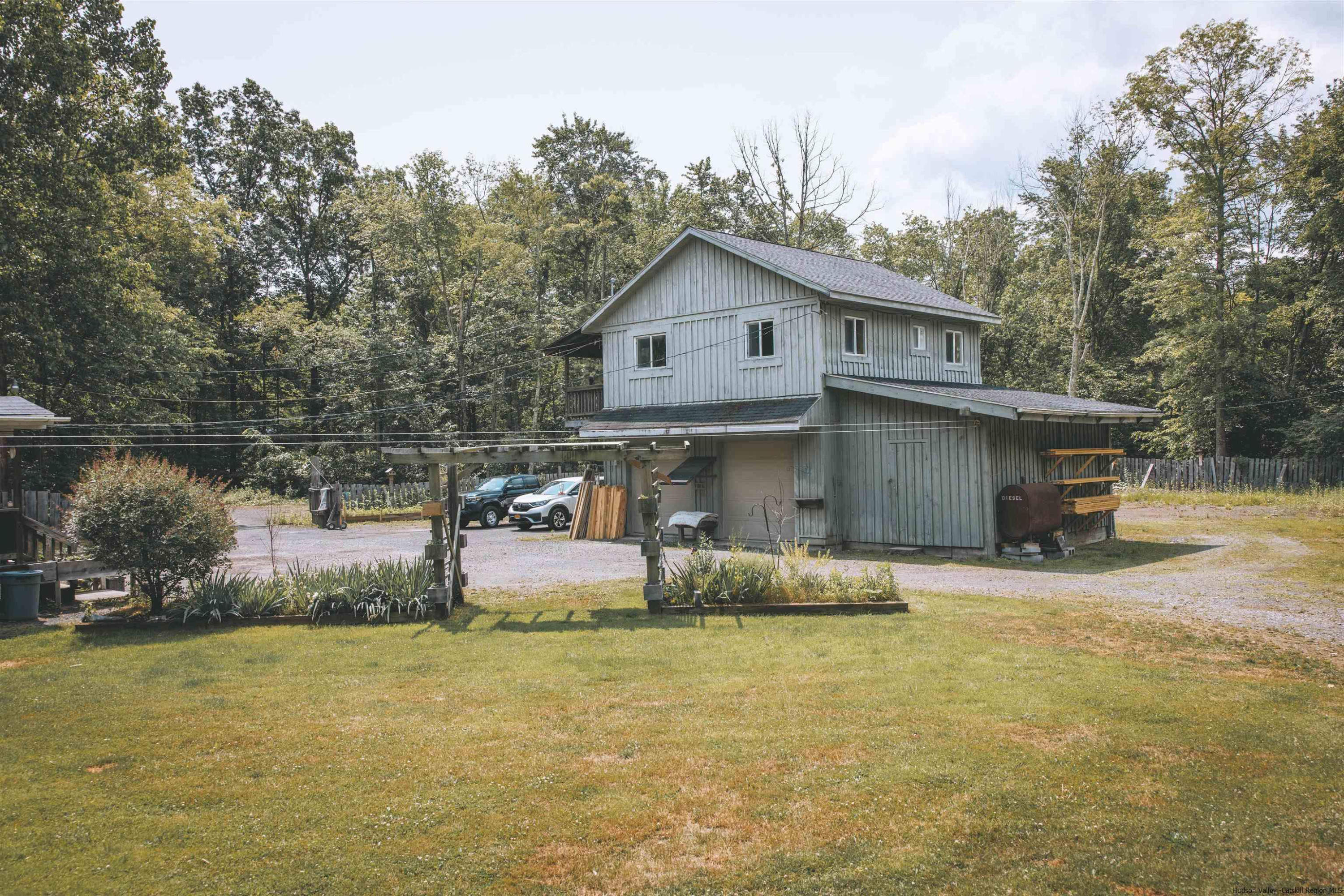 186 Patch Road Saugerties, NY 12477 - Photo 3 of 34 a front view of a house with a yard and garage