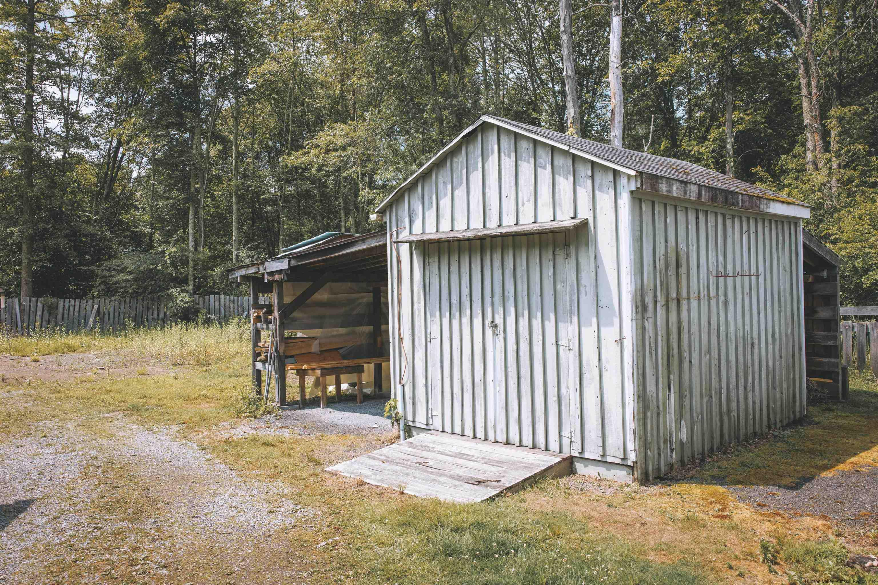 186 Patch Road Saugerties, NY 12477 - Photo 32 of 34 a backyard of a house with lake view and a trees
