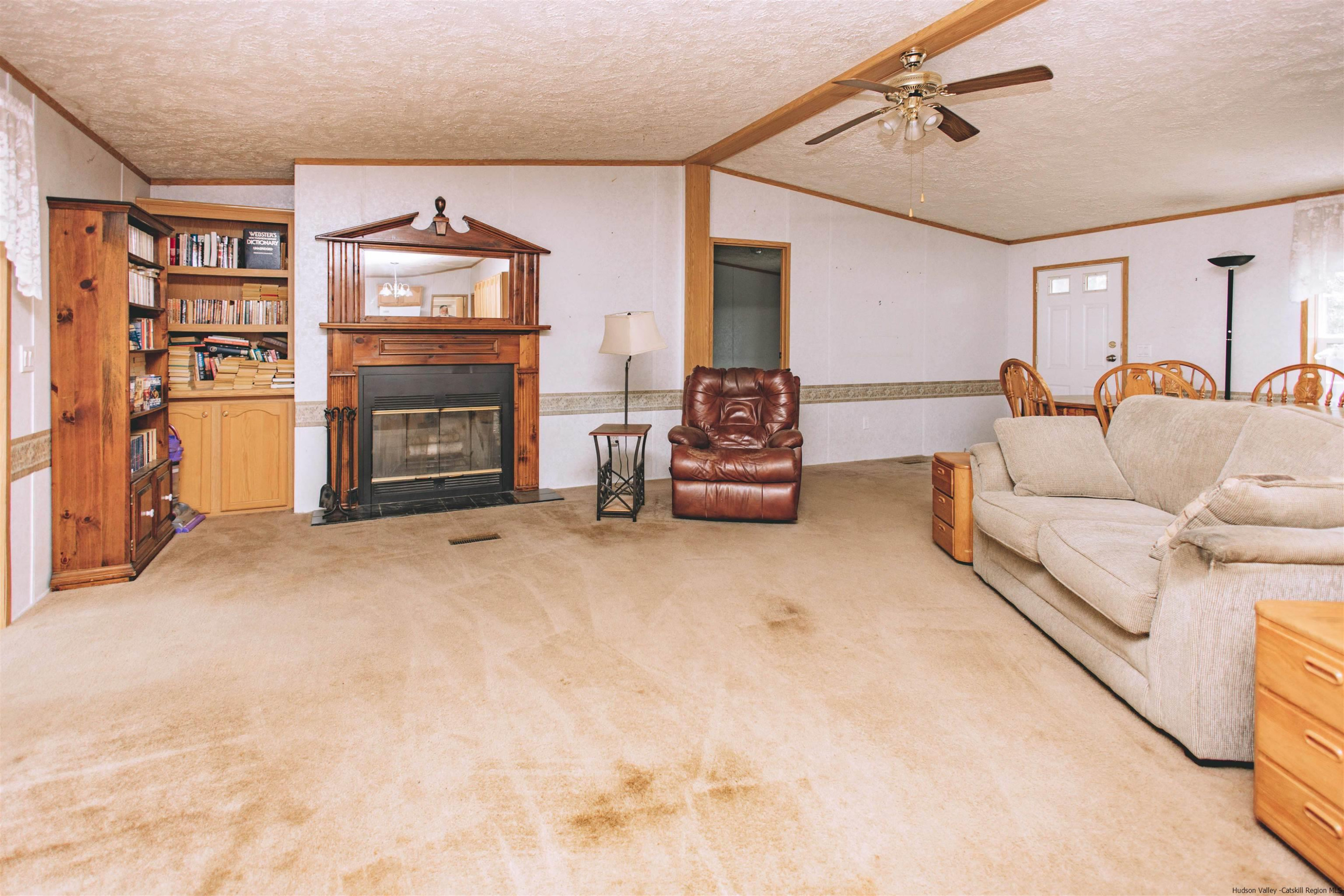 186 Patch Road Saugerties, NY 12477 - Photo 9 of 34 a living room with furniture and a fireplace