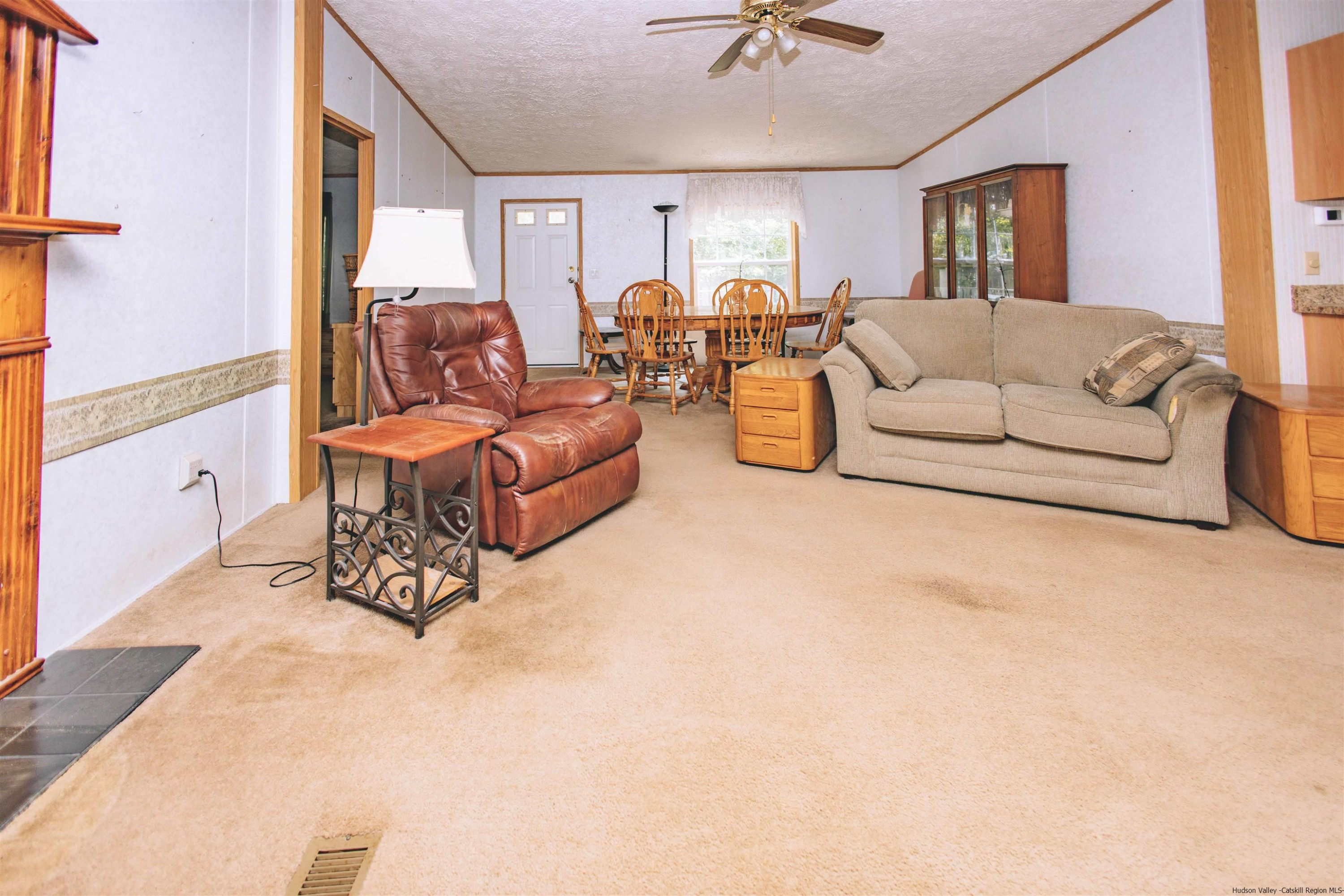 186 Patch Road Saugerties, NY 12477 - Photo 10 of 34 a living room with furniture and a chandelier