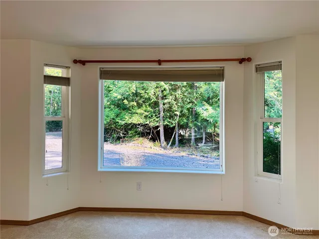 a view of two windows and a yard