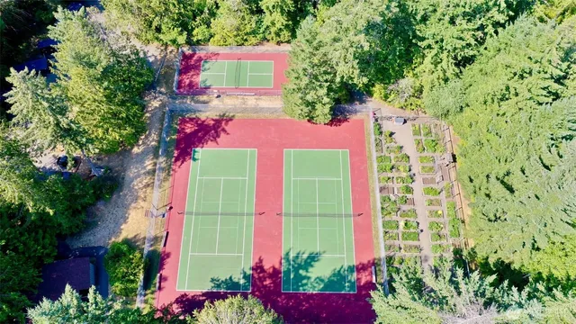 a sign that is in front of flowers