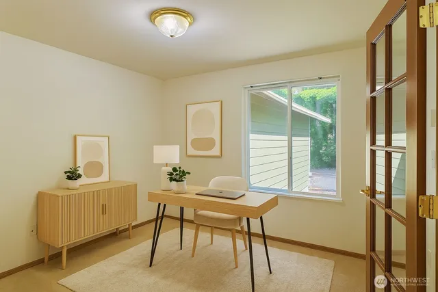 a workspace with furniture and window