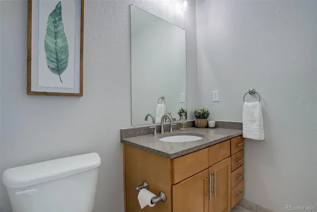 a room with furniture and a ceiling fan