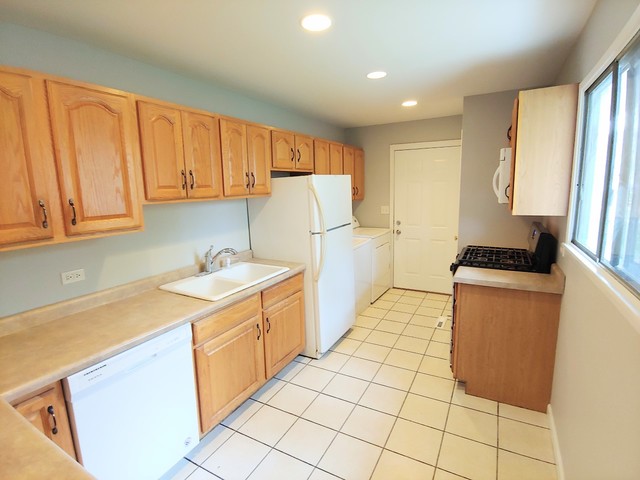 13 Wren Road Carpentersville, IL 60110 - Photo 4 of 11 a kitchen with a sink cabinets and appliances