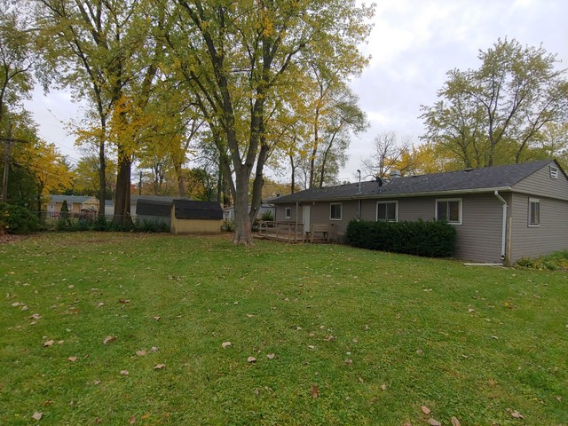 13 Wren Road Carpentersville, IL 60110 - Photo 10 of 11 a view of a yard in front of a house with large trees
