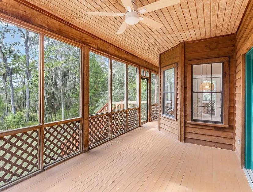 1525 Black Island Road Darien, GA 31305 - Photo 27 of 41 a view of a porch with wooden floor and outdoor space