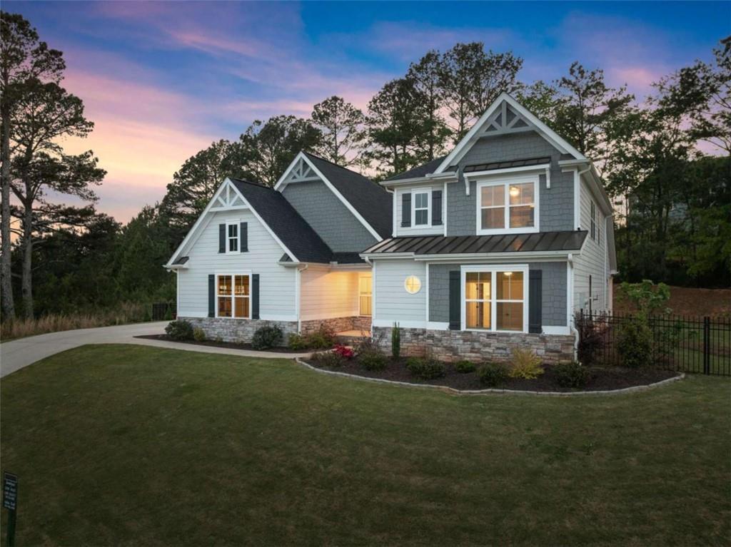 876 Sweetgrass Drive Demorest, GA 30535 - Photo 1 of 56 a front view of a house with a yard