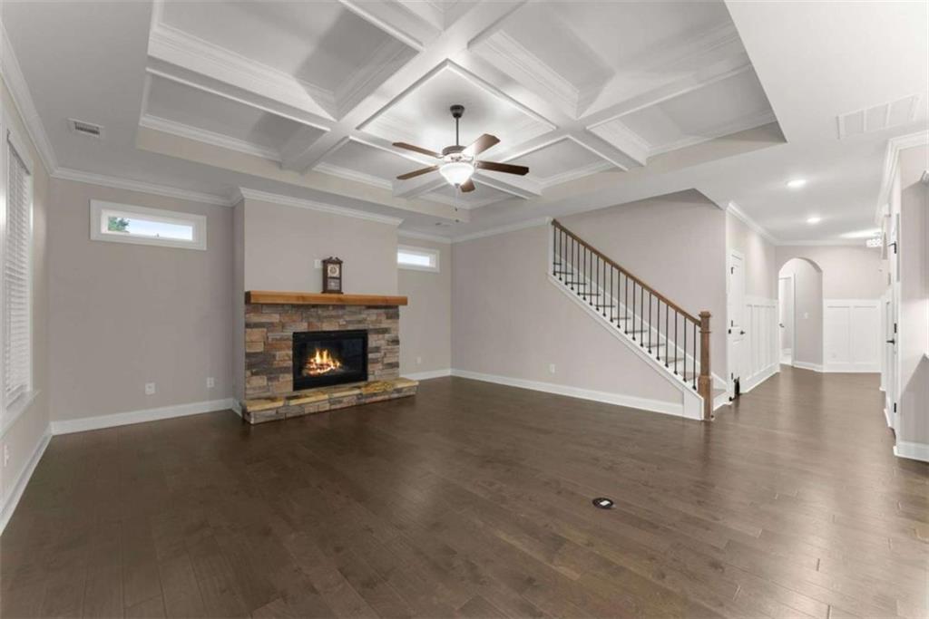 876 Sweetgrass Drive Demorest, GA 30535 - Photo 19 of 56 wooden floor with an entryway and a fireplace