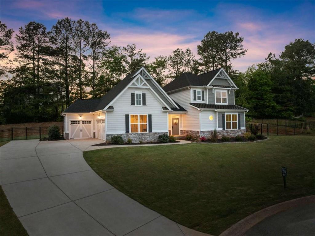 876 Sweetgrass Drive Demorest, GA 30535 - Photo 2 of 56 a front view of a house with a yard