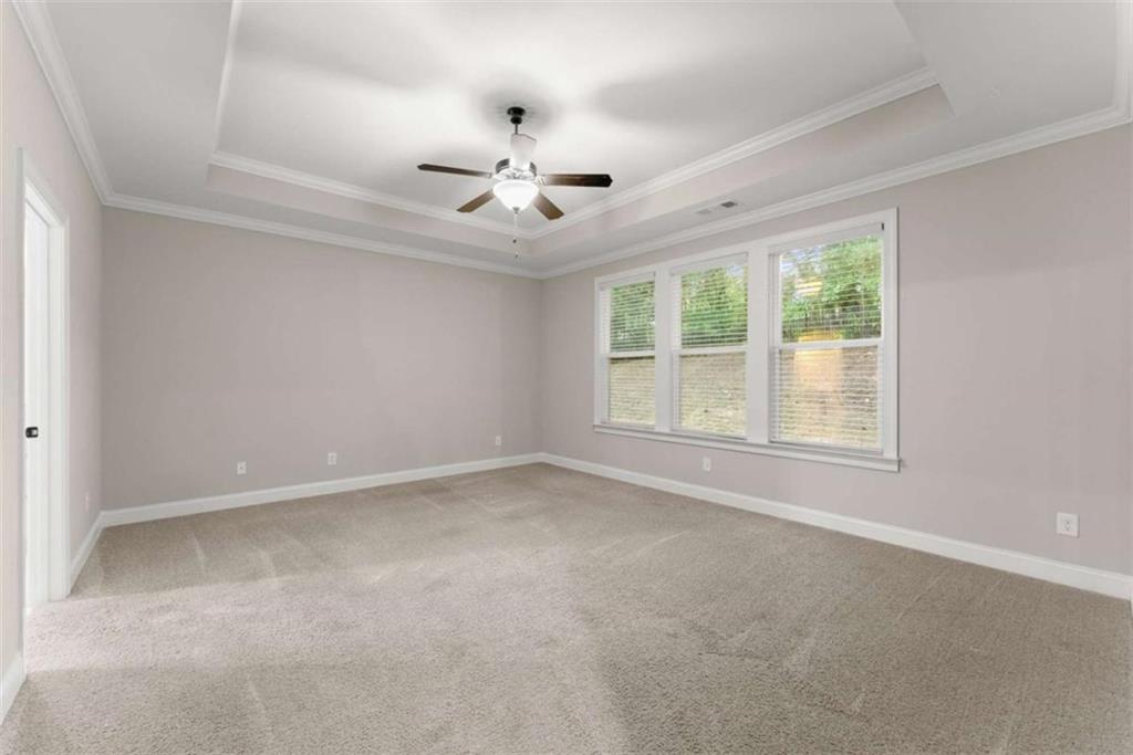 876 Sweetgrass Drive Demorest, GA 30535 - Photo 23 of 56 an empty room with a window and a fan
