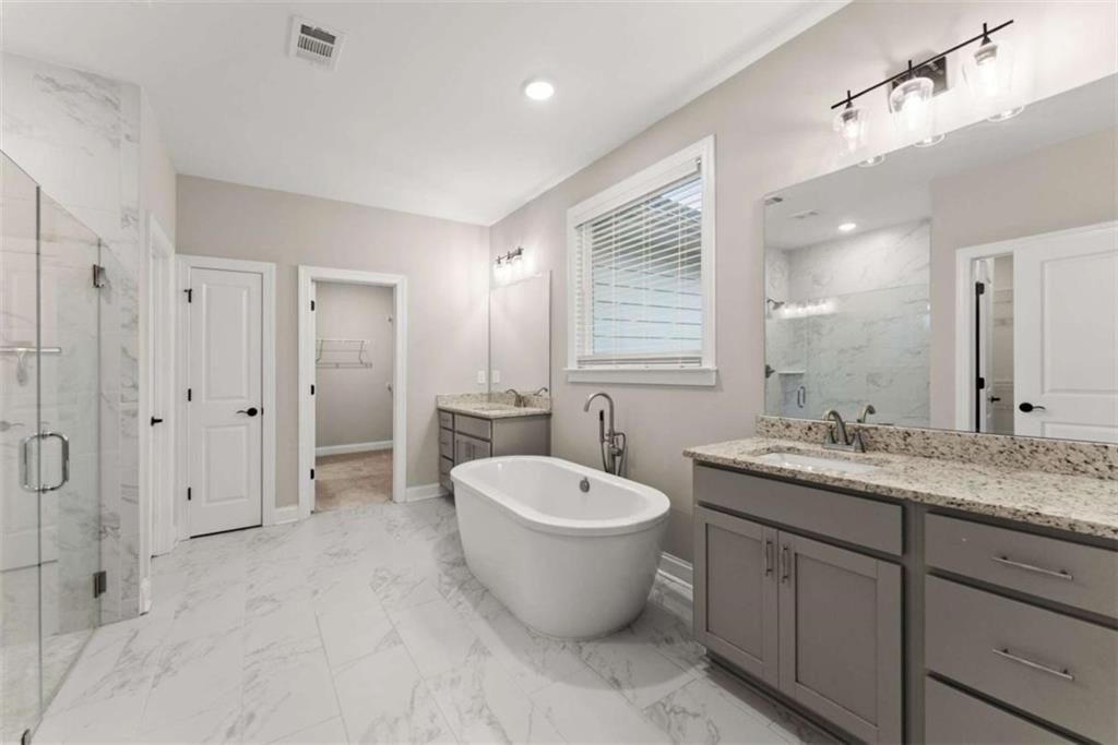 876 Sweetgrass Drive Demorest, GA 30535 - Photo 26 of 56 a bathroom with a granite countertop sink toilet and shower