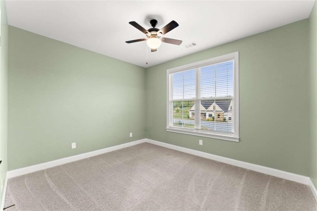 876 Sweetgrass Drive Demorest, GA 30535 - Photo 5 of 56 an empty room with window and ceiling fan