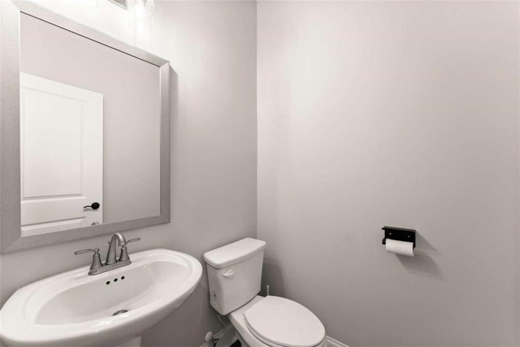 876 Sweetgrass Drive Demorest, GA 30535 - Photo 9 of 56 a bathroom with a sink mirror and toilet