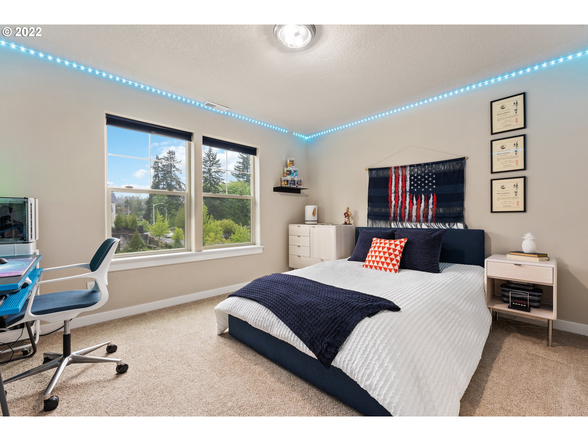 14026 Southwest 118th Court Tigard, OR 97224 - Photo 11 of 31 a bedroom with a bed and a large window