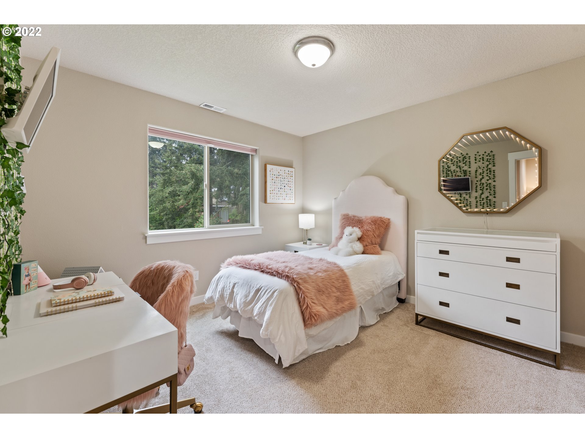 14026 Southwest 118th Court Tigard, OR 97224 - Photo 17 of 31 a bedroom with a bed and a window