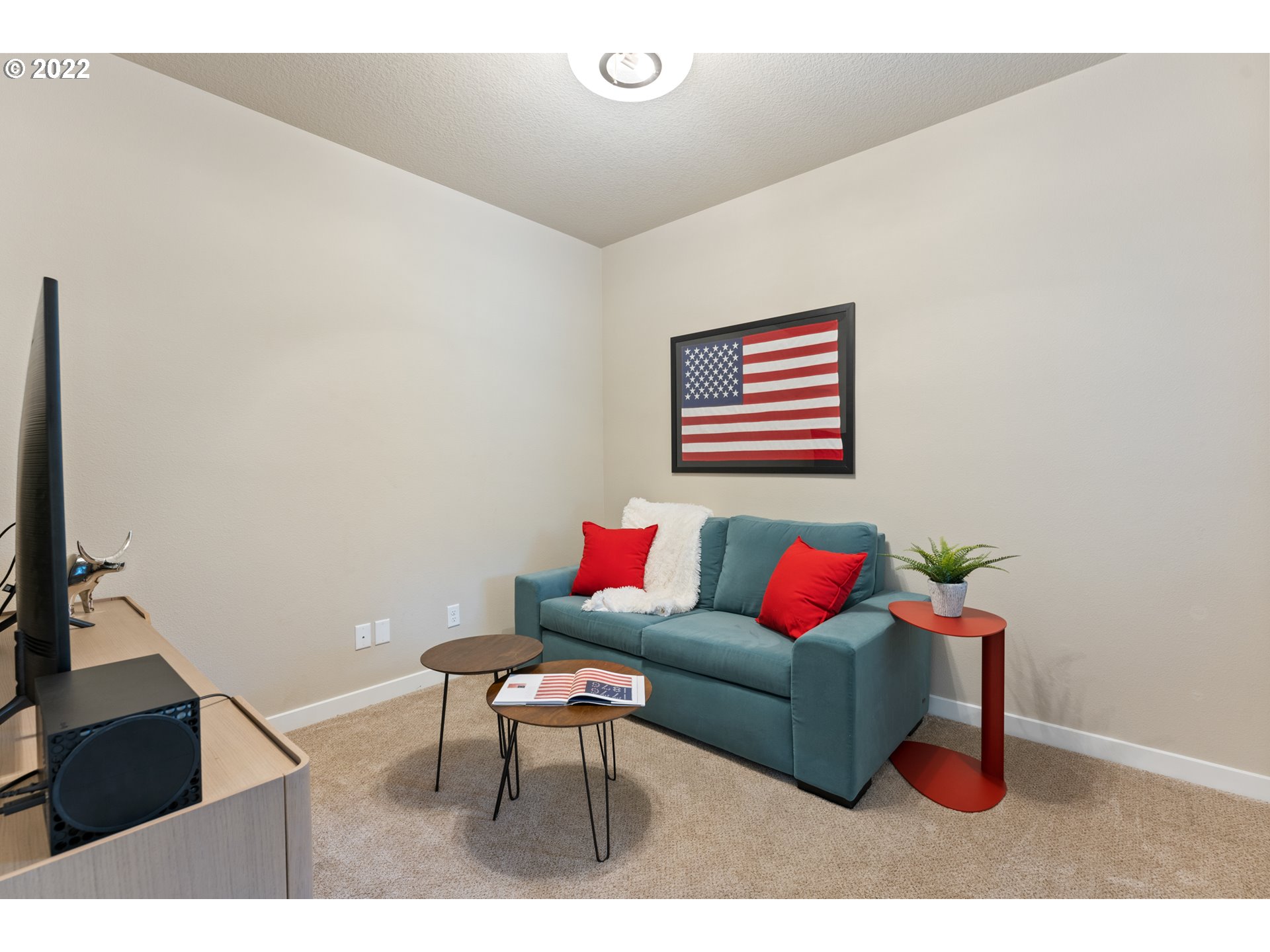 14026 Southwest 118th Court Tigard, OR 97224 - Photo 23 of 31 a living room with furniture and a flat screen tv