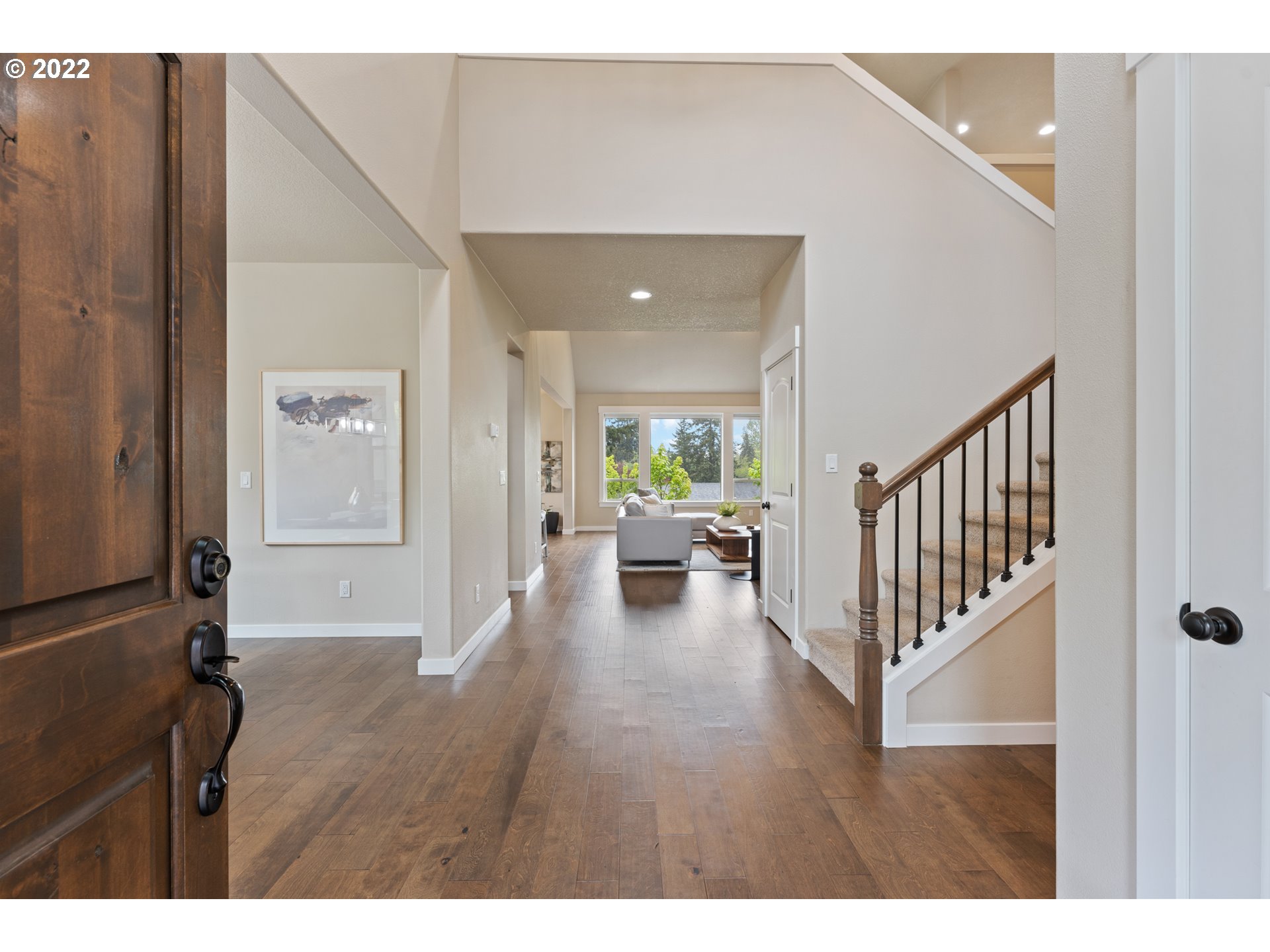 14026 Southwest 118th Court Tigard, OR 97224 - Photo 3 of 31 a view of a hallway with wooden floor and furniture