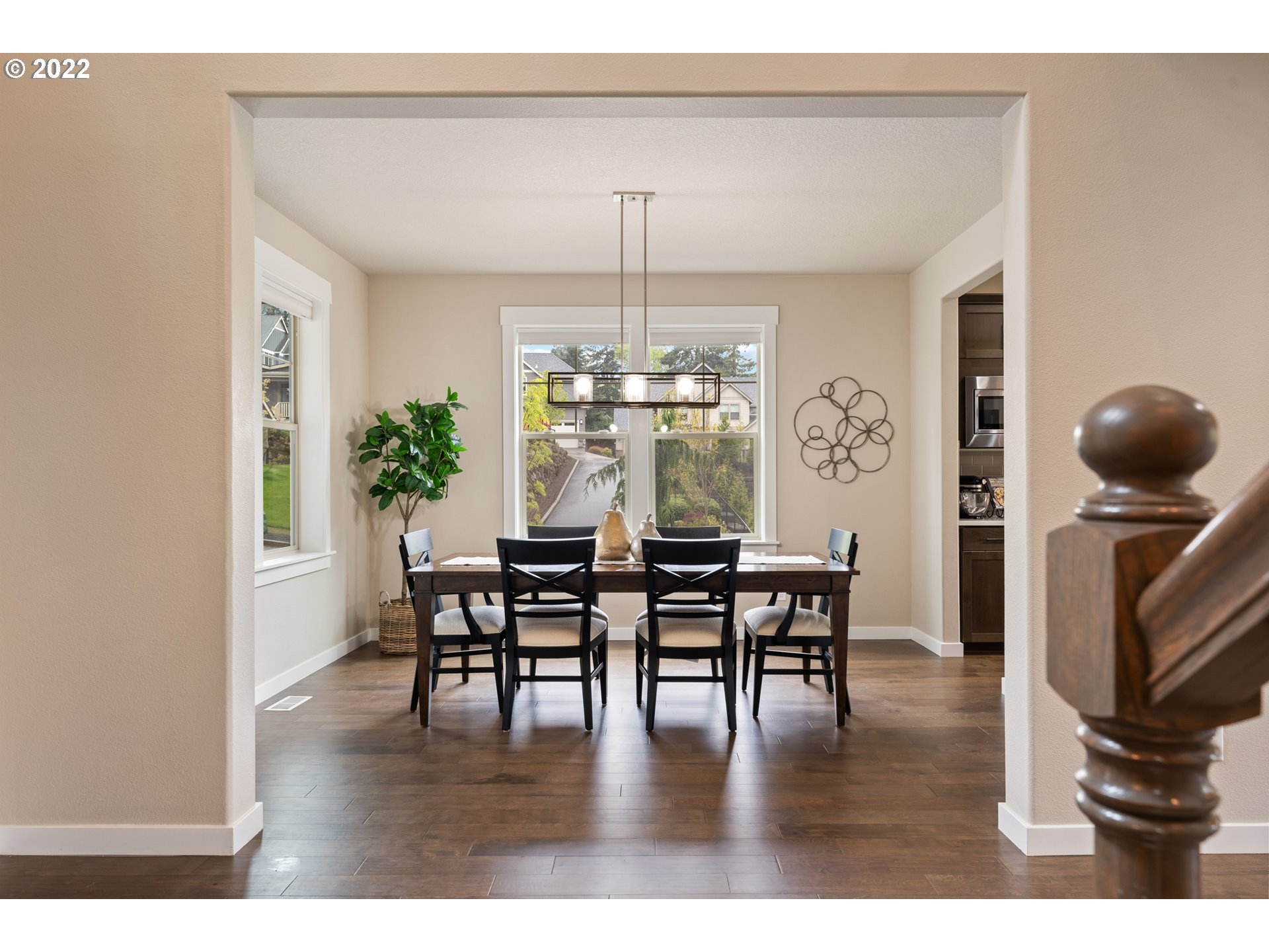 14026 Southwest 118th Court Tigard, OR 97224 - Photo 4 of 31 a dining room with furniture wooden floor and a chandelier