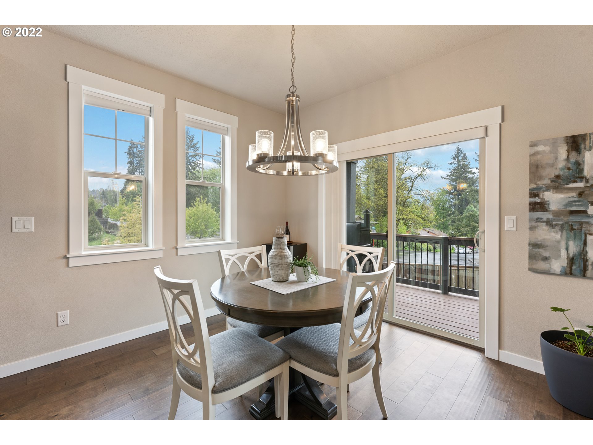 14026 Southwest 118th Court Tigard, OR 97224 - Photo 7 of 31 a dining room with furniture a chandelier and wooden floor