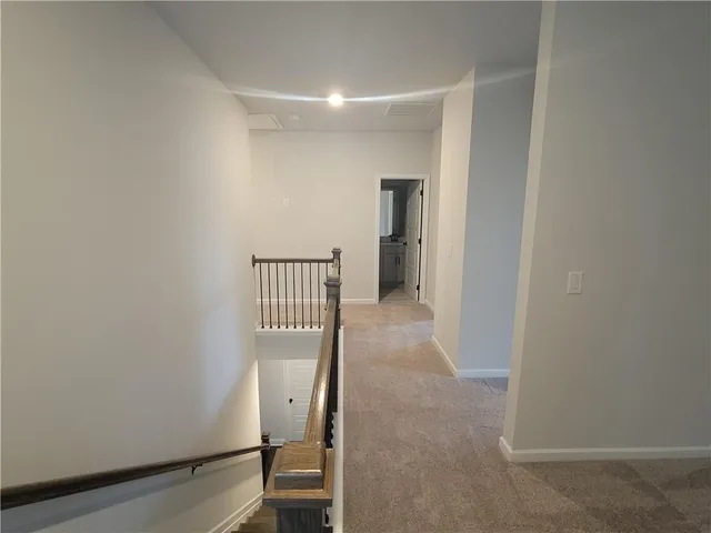 a view of a hallway with a room