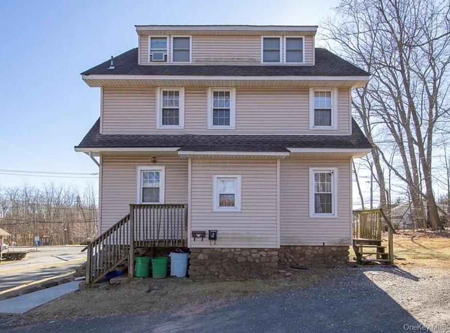 502 West Nyack Road, Unit 1 West Nyack, NY 10994 - Photo 3 of 12 a front view of a house with a yard