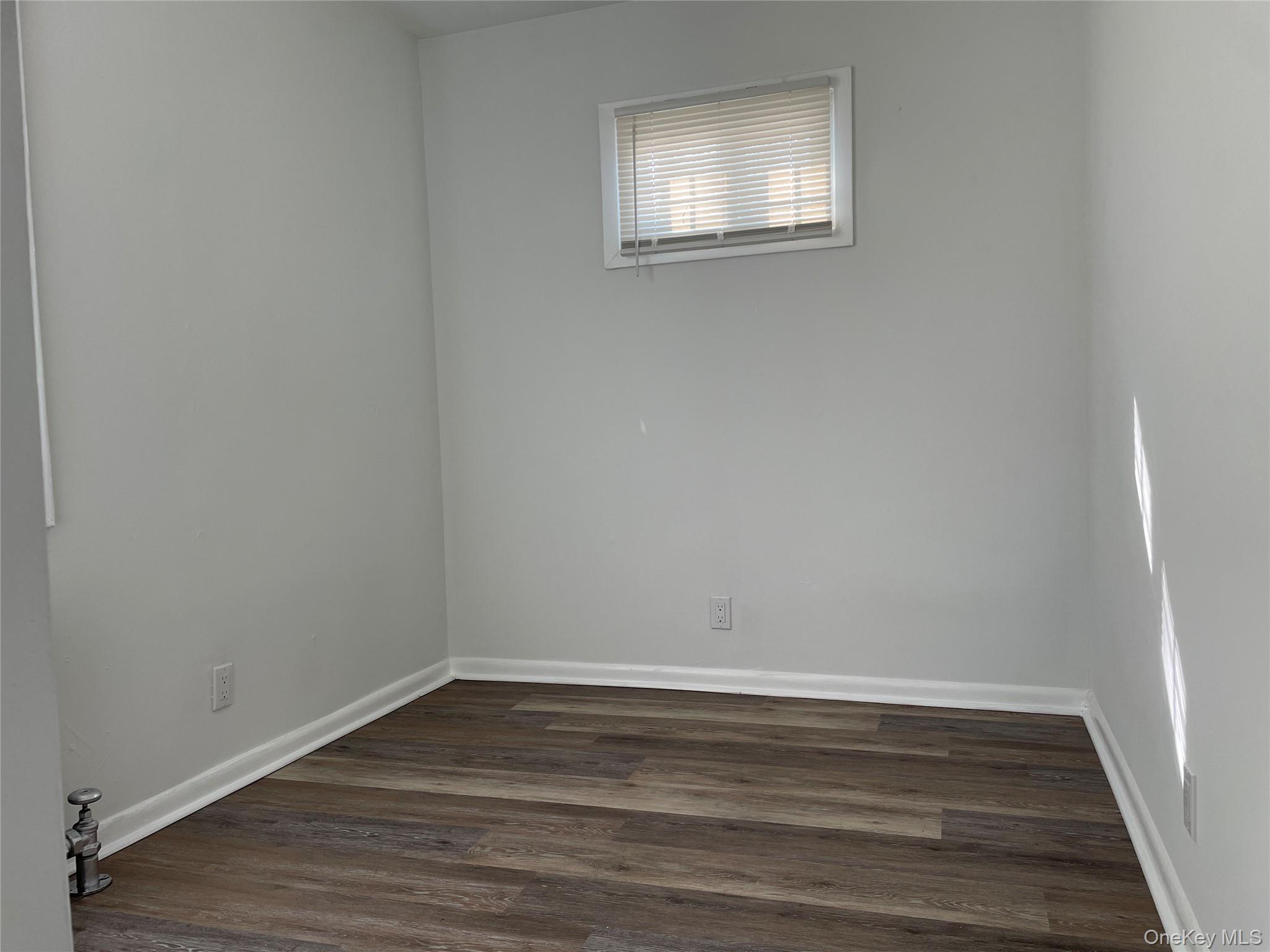 502 West Nyack Road, Unit 1 West Nyack, NY 10994 - Photo 9 of 12 a view of a room that has wooden floor and white walls