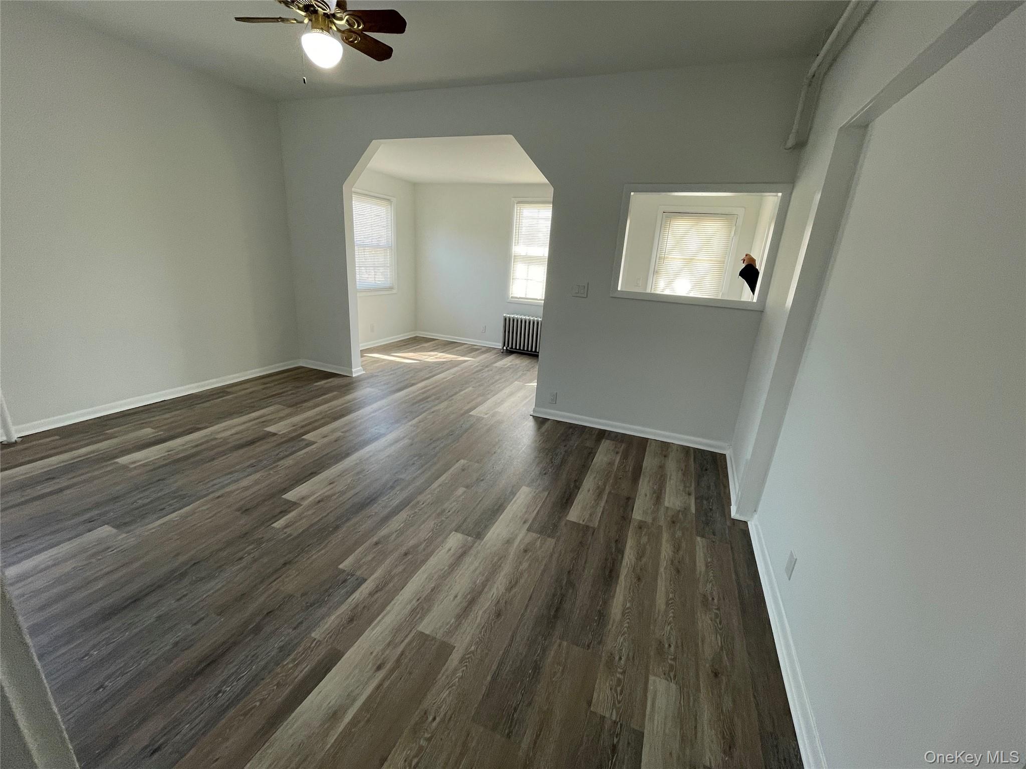 502 West Nyack Road, Unit 1 West Nyack, NY 10994 - Photo 10 of 12 wooden floor in an empty room with a window