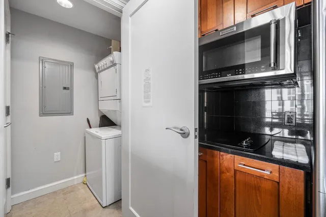 a kitchen with a sink and a refrigerator