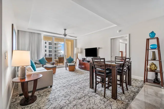 a view of a livingroom with furniture and a flat screen tv