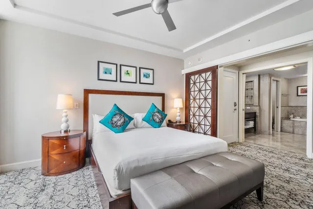 a bedroom with a bed and a couch