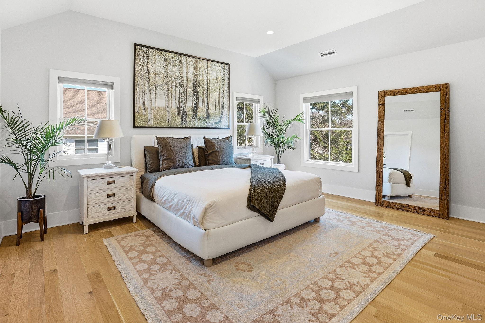 72 Valley Terrace Rye Brook, NY 10573 - Photo 15 of 32 a spacious bedroom with a large bed and a window