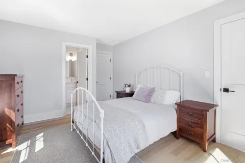 a bedroom with a bed and a cabinets