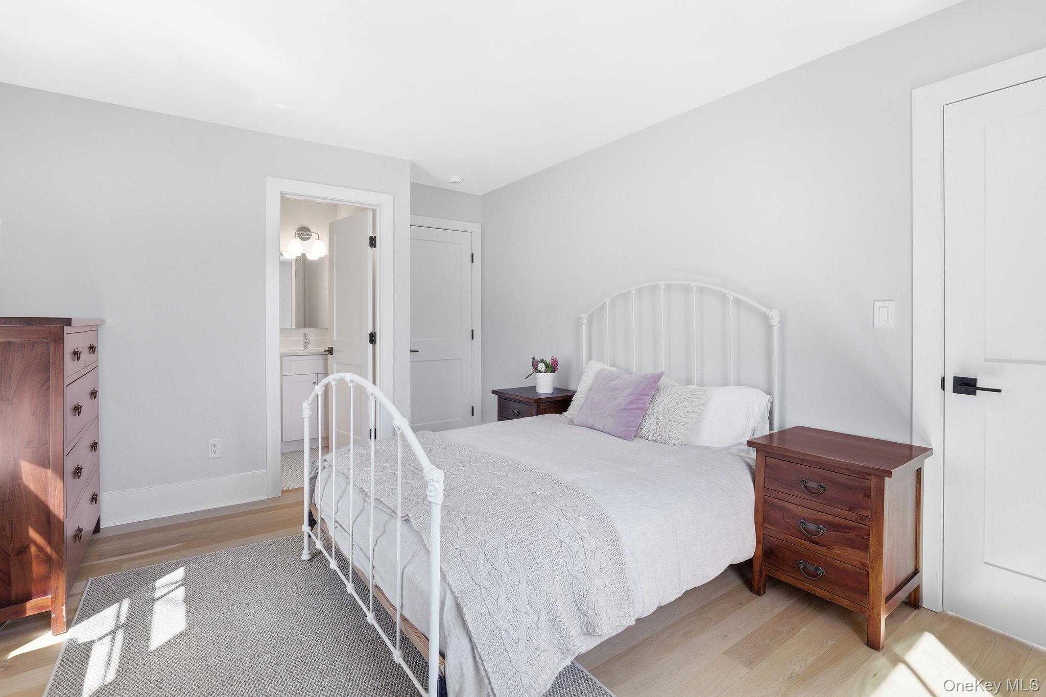 72 Valley Terrace Rye Brook, NY 10573 - Photo 19 of 32 a bedroom with a bed and a cabinets