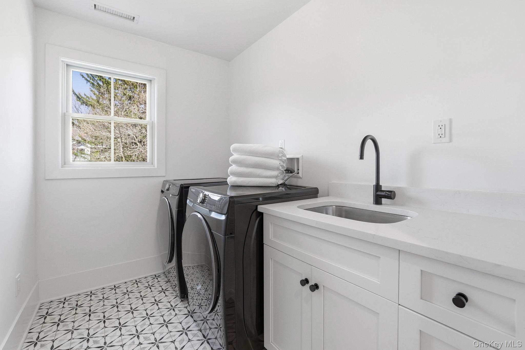 72 Valley Terrace Rye Brook, NY 10573 - Photo 23 of 32 a close view of a sink and washer dryer
