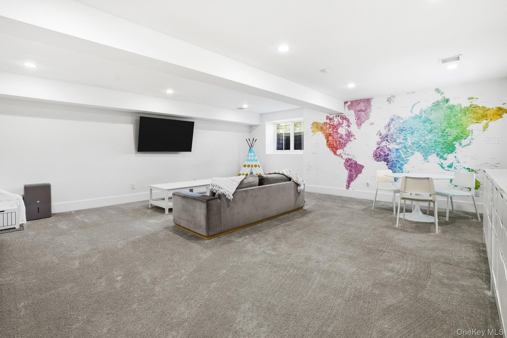72 Valley Terrace Rye Brook, NY 10573 - Photo 26 of 32 a living room with furniture and a flat screen tv