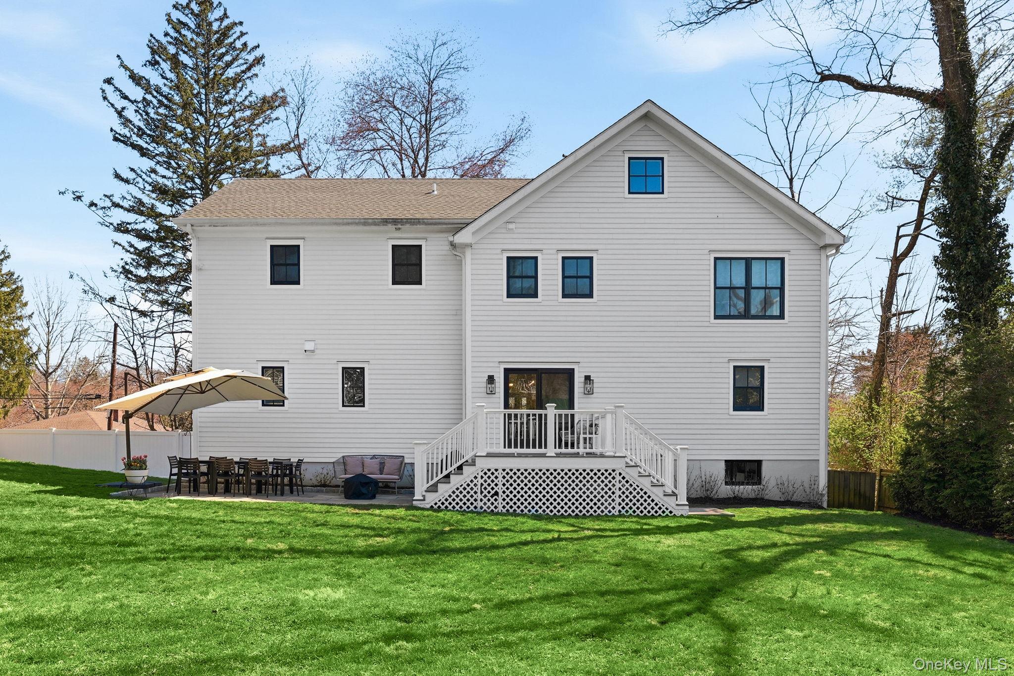 72 Valley Terrace Rye Brook, NY 10573 - Photo 28 of 32 a front view of house with a garden