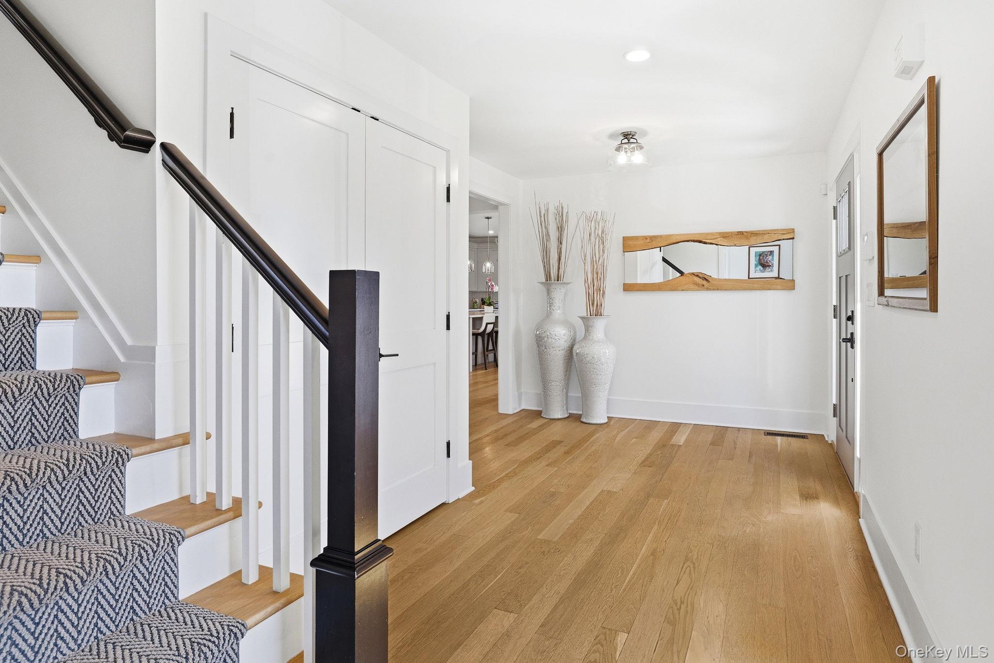 72 Valley Terrace Rye Brook, NY 10573 - Photo 4 of 32 a view of a bedroom with wooden floor and stairs