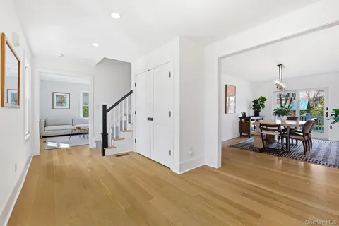 a view of a livingroom with furniture and hardwood floor