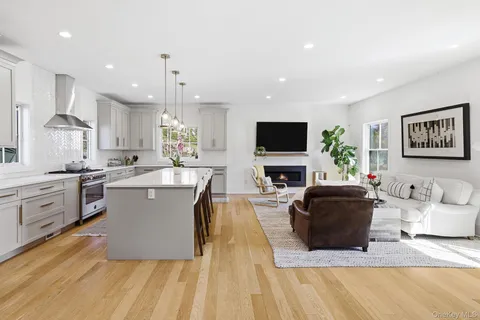 a kitchen with a sink appliances and cabinets